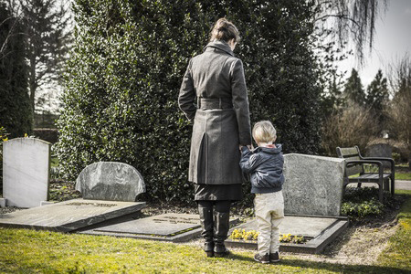 Standing at a Grave - Coupons4Utah