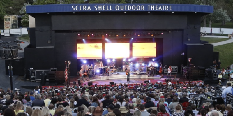people enjoying an outdoor concert event